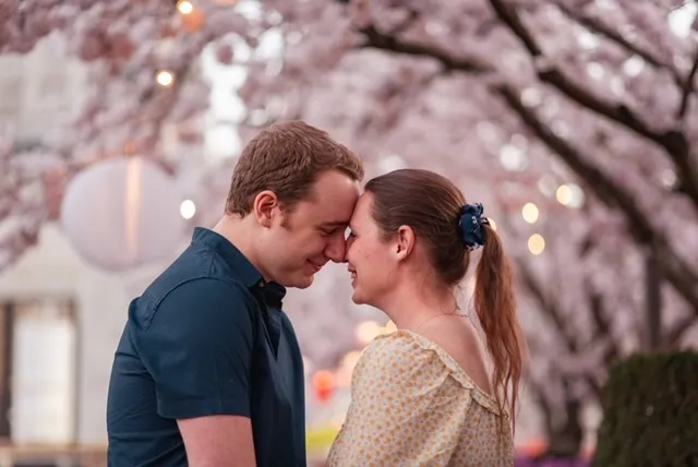 Sarah and Louis under cherry blossoms